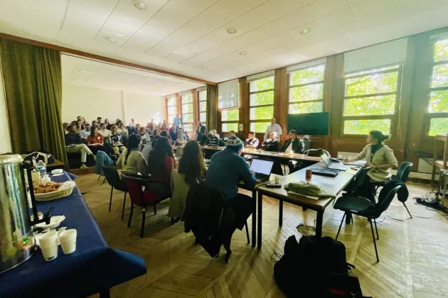 a seminar room packed with people in Paris