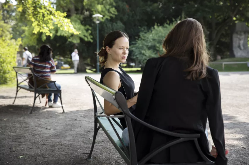 Two women sitting on a bench