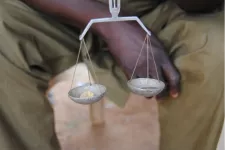 Picture of gold being weighed in a scale 